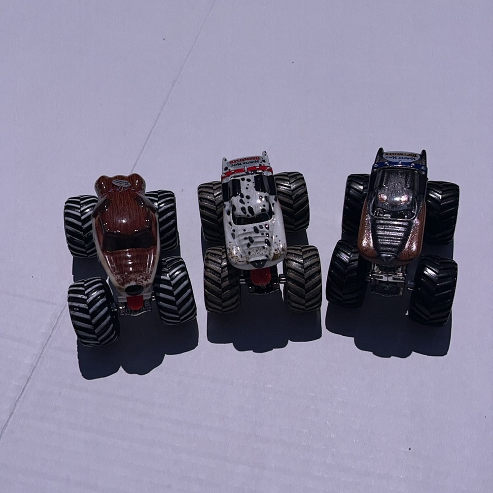 Set of three monster trucks, monster mutt Rottweiler, dalmatian, 2010  champion.
